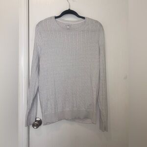 white cable-knit crewneck sweater